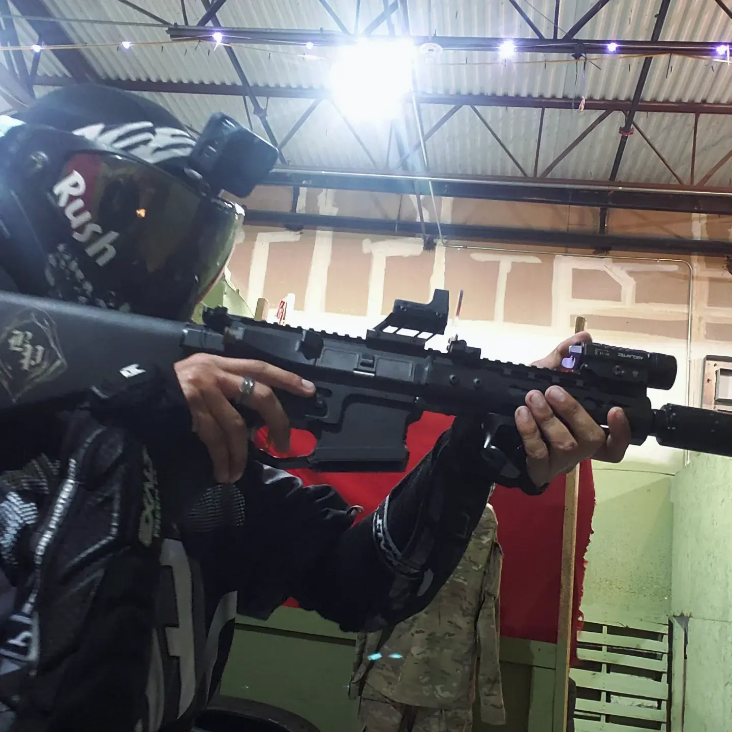 A player aiming under overhead light