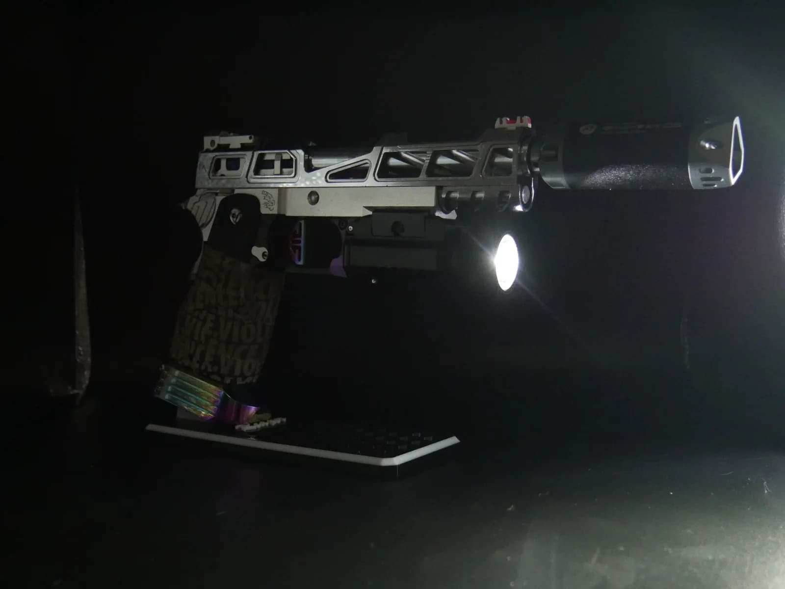 Chrome Junkie Hi-Capa, light on in a dark room